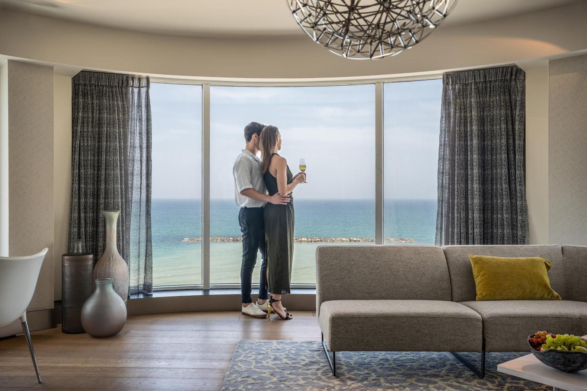 Royal Beach Hotel Tel Aviv By Isrotel Exclusive Exterior photo The view from the living room of a suite at the Hilton Tel Aviv